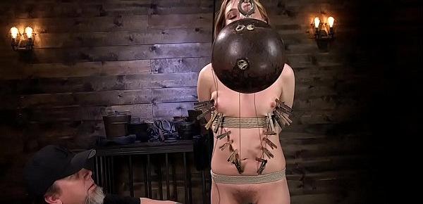  Tied up blonde holds bowling ball